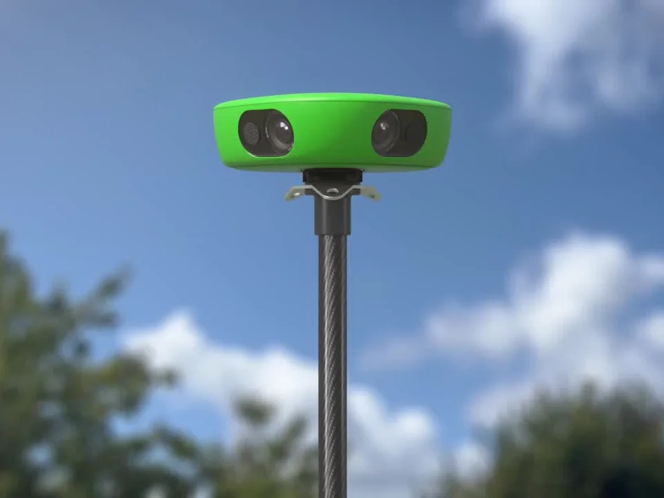 Veo Cam 3, a green dome camera with two lenses, mounted on a tall carbon-fiber pole